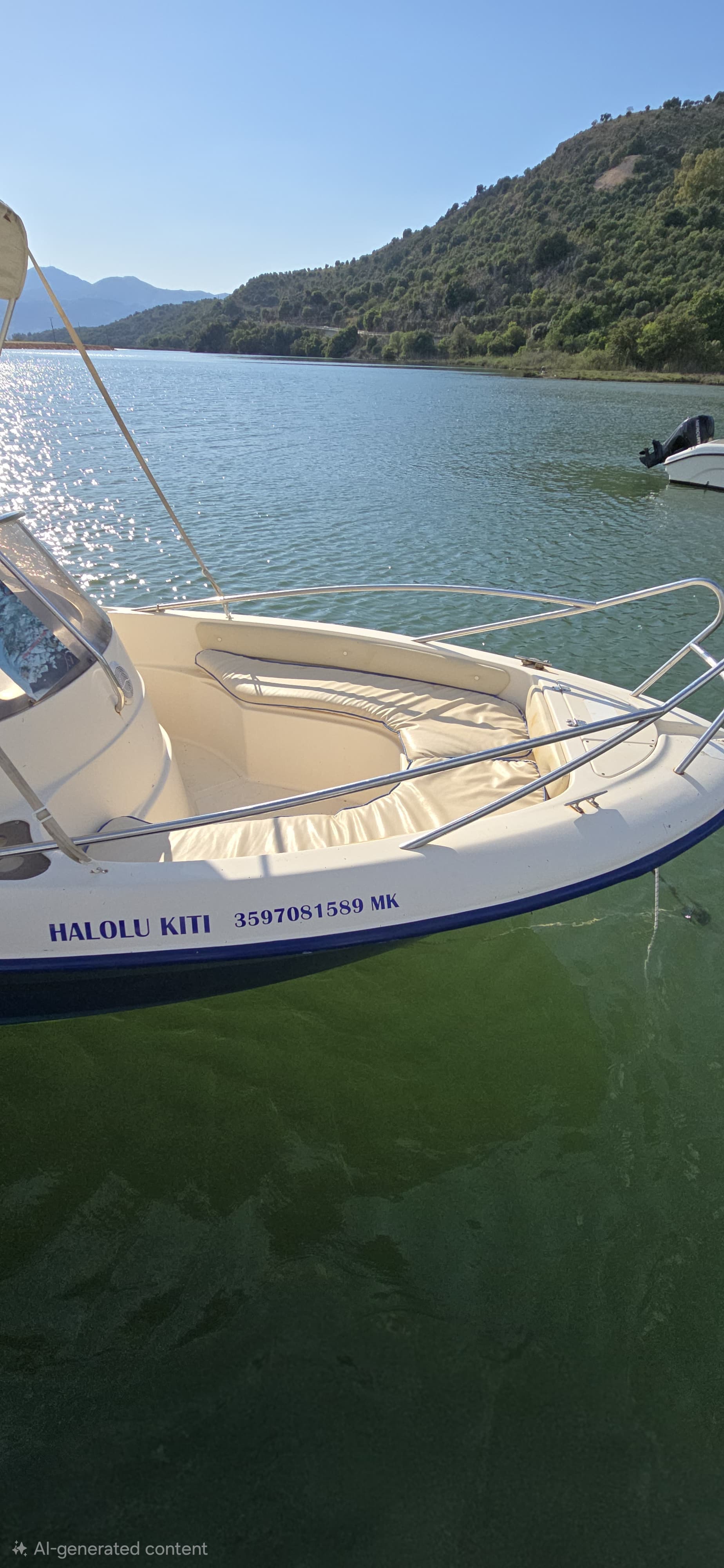 Close-up of Halolu Kiti speedboat hull showing the official boat name and official registration number